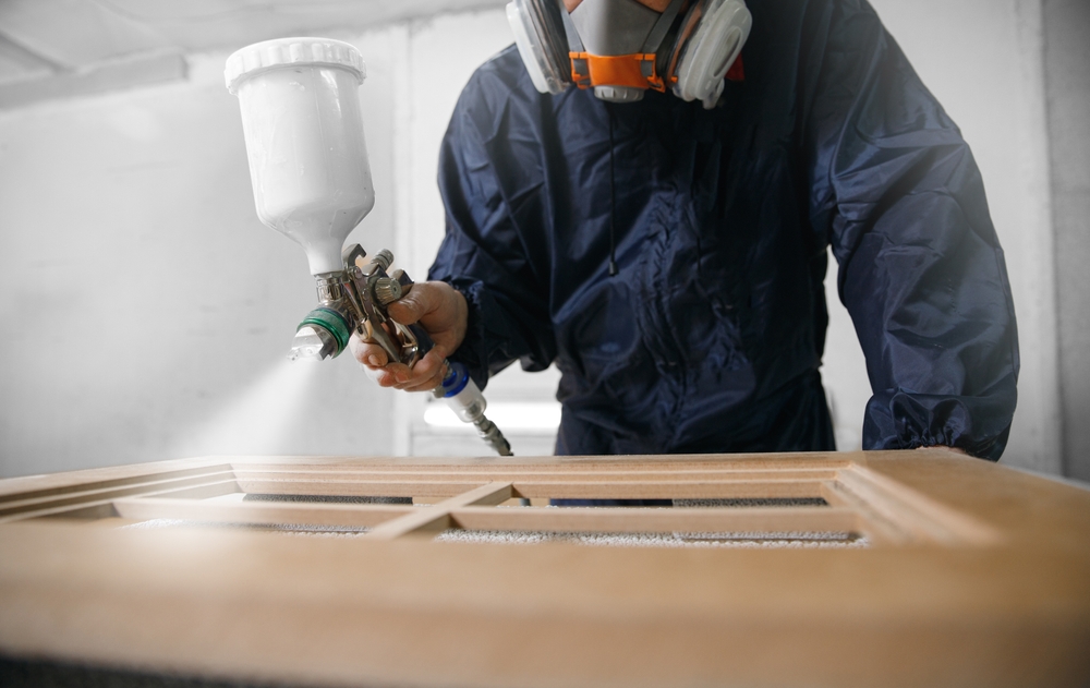 image_Professional,Worker,Staining,Wood,Furniture,With,Spray,Gun.