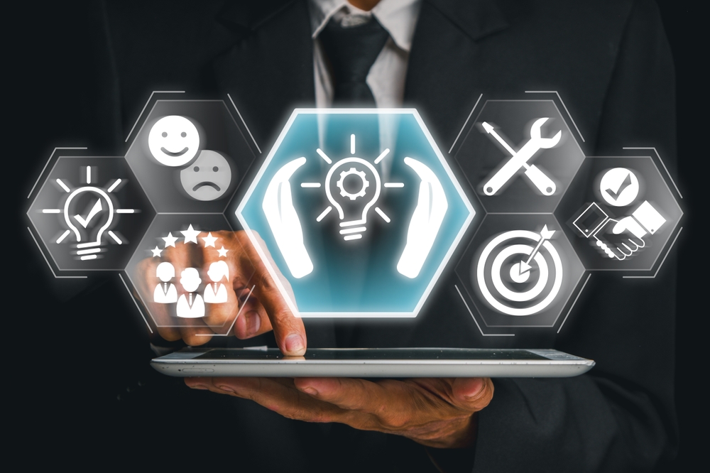 image_Businessman,Using,A,Tablet,With,Futuristic,Icons,Representing,Tailored,Solutions,