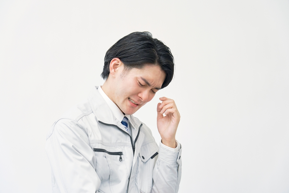 image_Asian,Worker,Being,Sad,In,White,Background