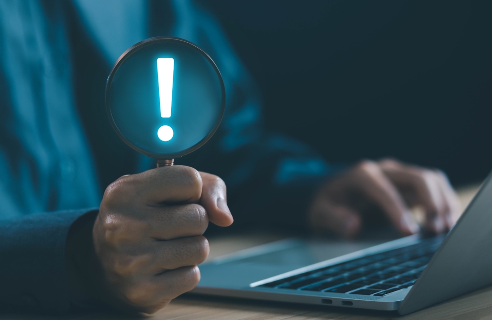 image_Businessman,Shows,An,Icon,Exclamation,Mark.,Points,Attention.,Concept,Of