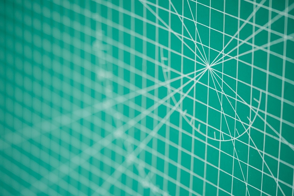 image_Close-up,Of,A,Green,Cutting,Mat,With,White,Grid,Lines