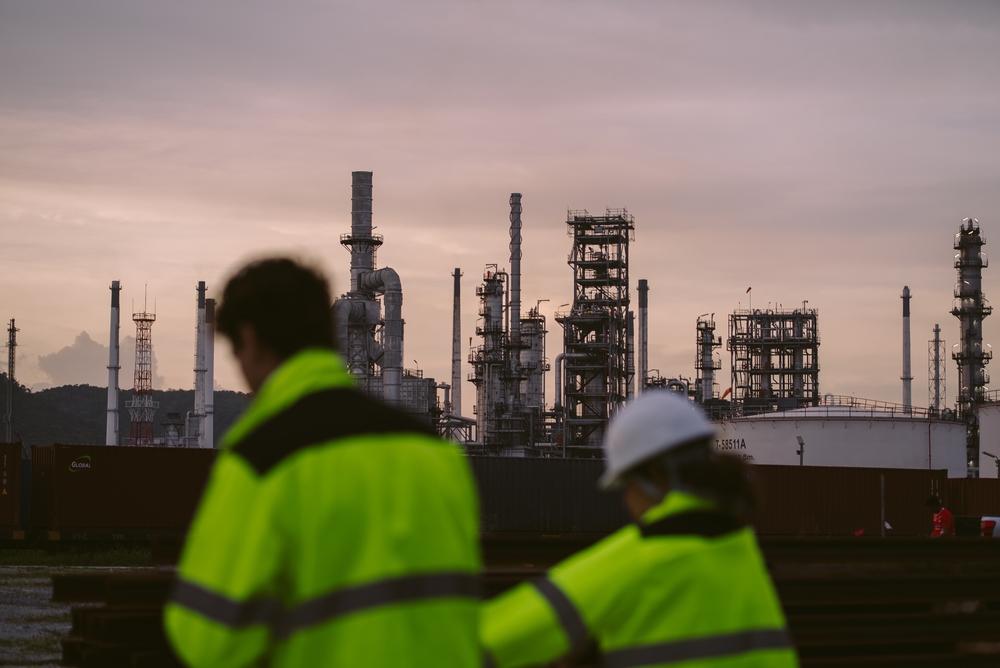 image_Two,Industrial,Workers,,Wearing,High-visibility,Jackets,,Focus,On,Background,Of